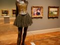 A Degas stands surrounded by masterpieces of Impressionist art at the St. Louis Art Museum.